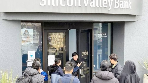 A worker (center) tells people that the Silicon Valley Bank (SVB) headquarters is closed on Friday in Santa Clara, California. — courtesy Getty Images