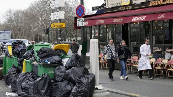 Bags of rubbish pile up in the streets of Paris. — courtesy Michel Euler/ AP.