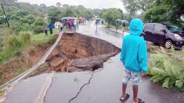 A general view of a collapsed road caused by flooding waters due to heavy rains following cyclone Freddy in Blantyre. — courtesy Getty Images