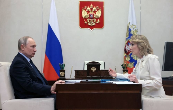 Russian President Vladimir Putin meets with Maria Lvova-Belova, Russian children's rights commissioner, at the Novo-Ogaryovo state residence, outside Moscow, on February 16, 2023. (Photo by Mikhail METZEL / SPUTNIK / AFP) (Photo by MIKHAIL METZEL/SPUTNIK/AFP via Getty Images)