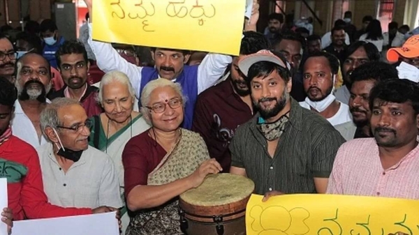 Chetan Kumar has participated in several protests. Picture shows Kumar (C-R) with social activist Medha Patkar (C-L) symbolically starting a protest meeting by beating a drum in Bangalore on January 14, 2022