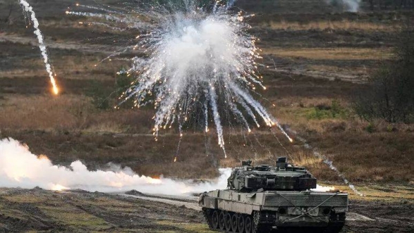 A Leopard 2 tank is seen in action at the Field Marshal Rommel Barracks in Augustdorf, Germany, Wednesday, Feb. 1, 2023