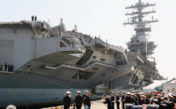 The aircraft carrier USS Nimitz arrives to a welcome ceremony at Busan, South Korea, Tuesday.