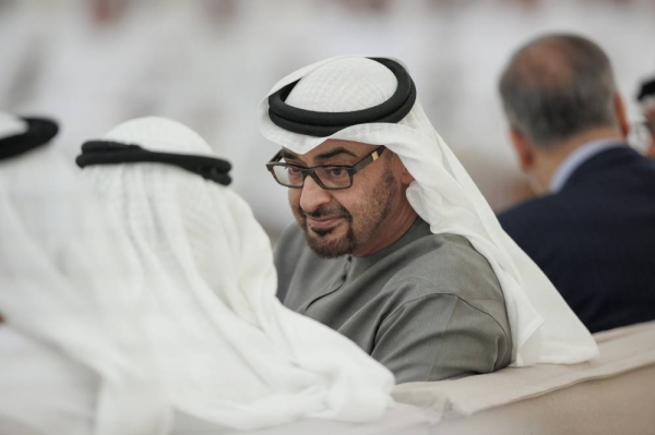 Sheikh Mohamed bin Zayed Al Nahyan, President of the United Arab Emirates speaks with a guest during an iftar reception at Al Bateen Palace. (WAM)