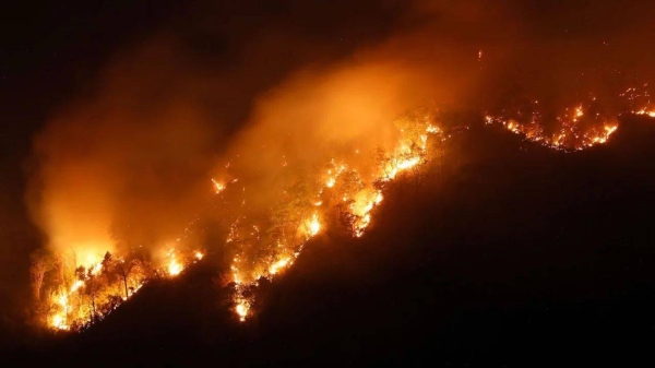A forest fire rages in Nakhon Nayok province, northeast of Bangkok, on March 30, 2023