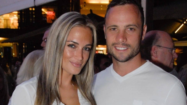 A picture taken on January 26, 2013 shows Olympian sprinter Oscar Pistorius posing next to his girlfriend Reeva Steenkamp at Melrose Arch in Johannesburg