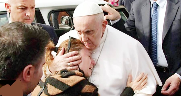 Pope Francis meets a faithful in this file photo.