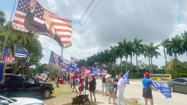 Several dozen demonstrators gathered at a Trump golf course in Palm Beach on Saturday.