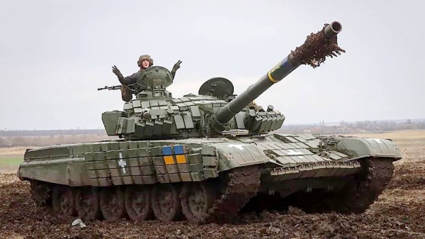 
A Ukrainian soldier waves atop a tank as he checks the readiness of equipment for combat deployment, at a military base in Zaporizhzhia region. — courtesy AP