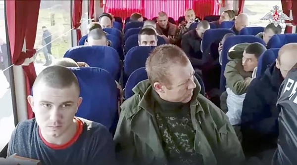 

Russian soldiers sit inside a bus after being released in a prisoner swap between Russia and Ukraine, at an unspecified location in Russia. — courtesy Russian Defense Ministry Press Service