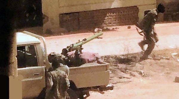 Vehicles mounted with machine guns on pick-up trucks making the rounds of Khartoum.