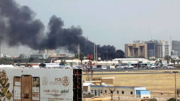 Heavy smoke billows above buildings in the vicinity of the Khartoum airport on April 15, 2023. — courtesy Getty Images