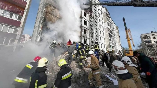 Rescuers work to clear rubble from a collapsed building in Iman. — courtesy Ukraine State Emergency Service