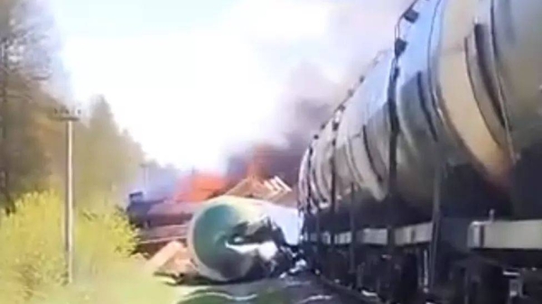 Train carriages turned over as the locomotive caught fire following an explosion