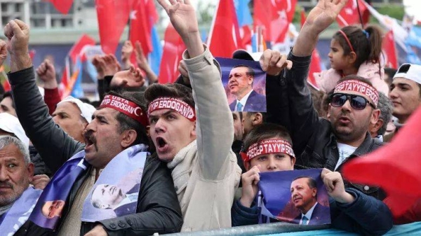 Supporters of Turkish President Recep Tayyip Erdogan cheer during his election campaign rally in Ankara, on April 30, 2023