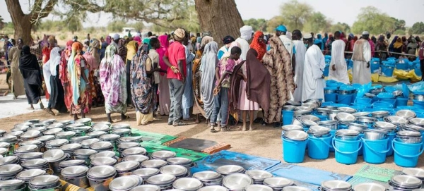 Food and other items are distributed in Chad to people who have fled violence in Sudan. — courtesy UNHCR/Colin Delfosse