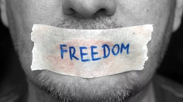 A man with freedom taped over his mouth.