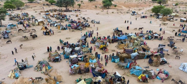 Newly arrived refugees from Sudan establish temporary shelters in Chad. — courtesy UNHCR/Colin Delfosse