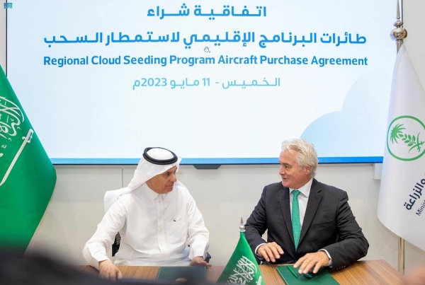 Minister of Environment, Water and Agriculture and Chairman of the Board of Directors of the National Center for Meteorology (NCM) Eng. Abdulrahman Al-Fadhli signs the agreement to purchase five cloud-seeding aircraft on Thursday.
