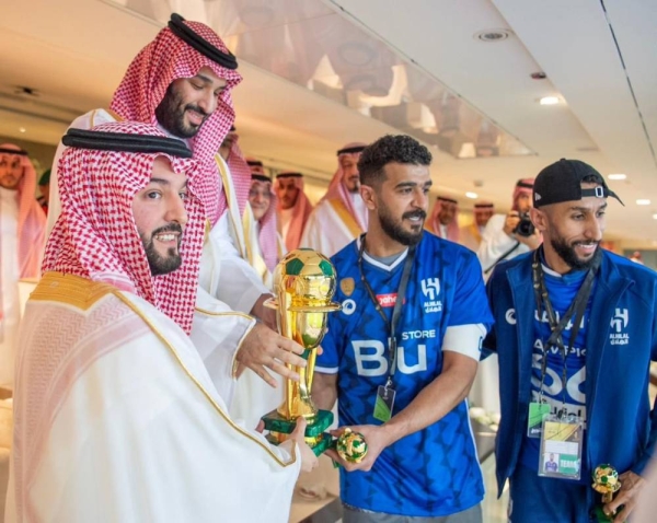 Crown Prince and Prime Minister Mohammed Bin Salman presents the King Cup of Champions to Al-Hilal at the King Abdullah Sports City Stadium in Jeddah.