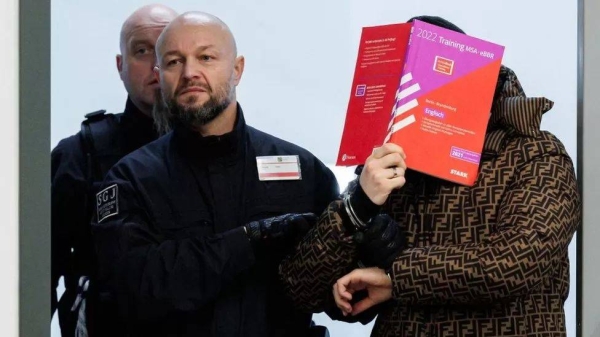 The defendants covered their faces with books and folders throughout the trial