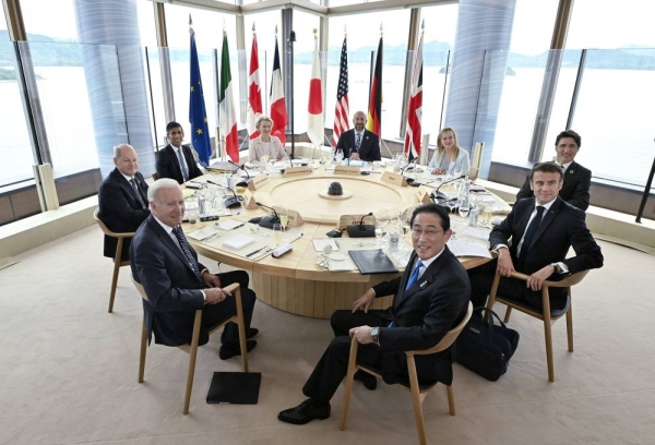 Leaders of the Group of Seven industrialized economies attend the first day of their three-day summit on May 19, 2023, in the western Japan city of Hiroshima. Pictured clockwise from front right are Japanese Prime Minister Fumio Kishida, U.S. President Joe Biden, German Chancellor Olaf Scholz, British Prime Minister Rishi Sunak, European Commission President Ursula von der Leyen, European Council President Charles Michel, Italian Prime Minister Giorgia Meloni, Canadian Prime Minister Justin Trudeau and French President Emmanuel Macron. (Pool photo) (Photo by Kyodo News via Getty Images)