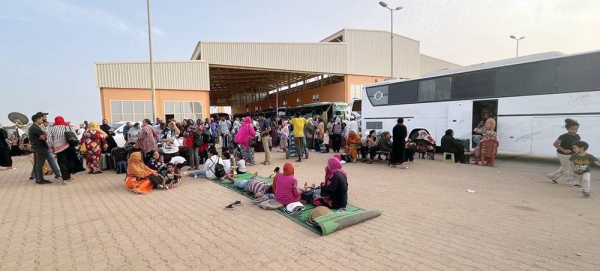 People fleeing conflict in Sudan wait at a bus station in Khartoum. — courtesy UNDP Sudan