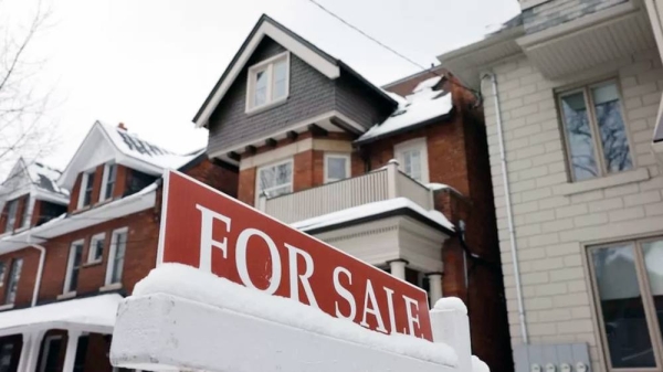 A For Sale sign is displayed outside a property on Brunswick Ave. in Toronto. — courtesy Lance McMillan/Toronto Star via Getty Images