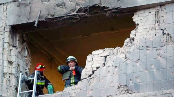 Rescuers inspect a building damaged during a Russian drone attack in Kyiv, Ukraine. — courtesy Reuters