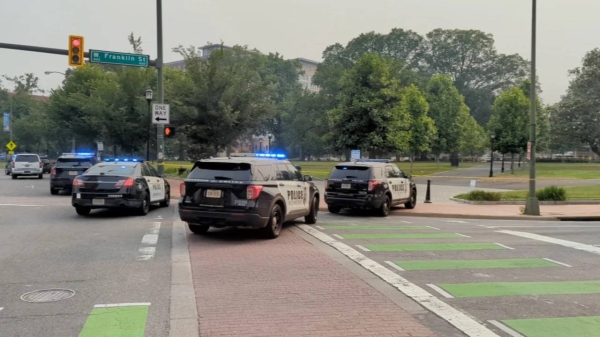 A gunman opened fire in a park in Richmond on Tuesday after a high school graduation ceremony took place across the street, police say.