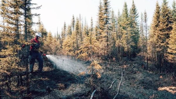 Firefighters in Quebec have been working 12-to-14 hour days to extinguish fires burning dangerously close to homes. — courtesy Audrey Marcoux/Sopfew