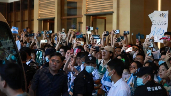 Fans wait for the arrival of Lionel Messi at a hotel in Beijing on June 10, 2023