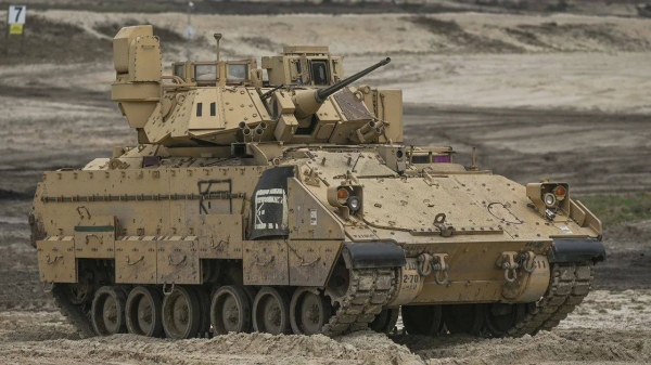 US soldiers from 2nd Battalion, 70th Armored Regiment, 1st Infantry Division, train with Bradley Fighting Vehicles at Nowa Deba, in Nowa Deba, Poland, on April 12, 2023