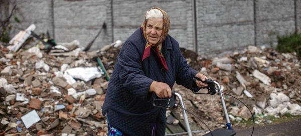 An older woman walks through the destroyed streets of Chernihiv, Ukraine. — courtesy UNICEF/Diego Ibarra Sánchez