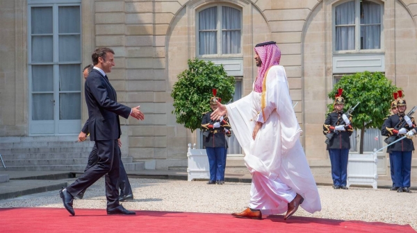 French President Emmanuel Macron receives Crown Prince Mohammed bin Salman at the Elysee Palace in Paris.