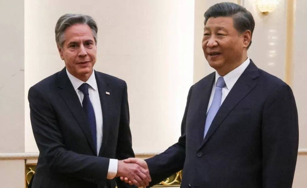 US Secretary of State Antony Blinken (L) shakes hands with China's President Xi Jinping at the Great Hall of the People in Beijing on June 19, 2023