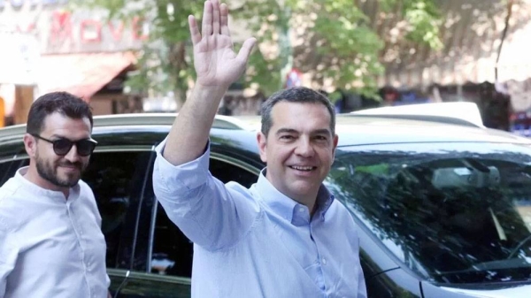 Alexis Tsipras waves to reporters in Athens, Greece. — courtesy EPA
