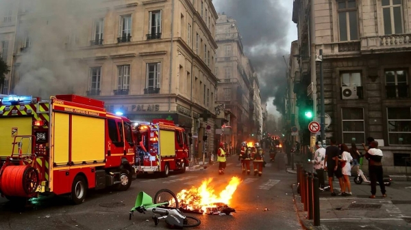 Looting is taking place amid the riots, French authorities say