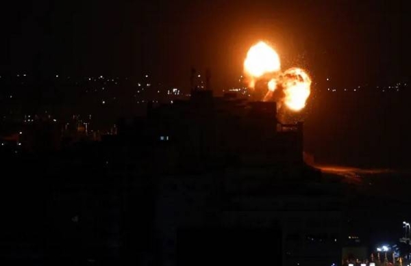 A screen grab shows smoke and flames during an Israeli air attack in Gaza on July 5