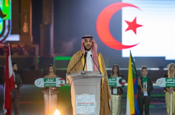 Saudi athletes participate in the parade.