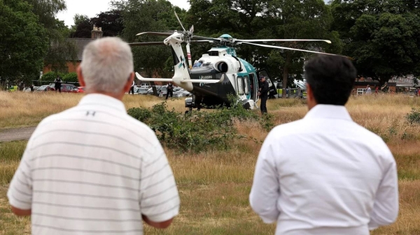 An air ambulance lands on Wimbledon Common in response to the incident.