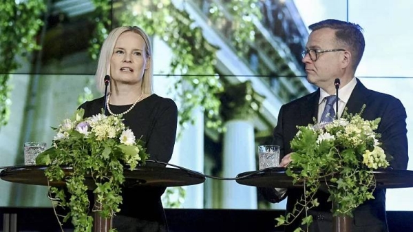 Finland's new Prime Minister Petteri Orpo (R) and his new Finance Minister Riikka Purra hold a press conference in Helsinki, Finland on June 20