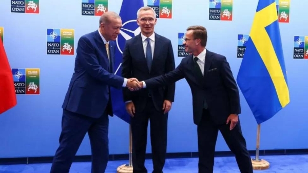 Turkish President Tayyip Erdogan and Swedish Prime Minister Ulf Kristersson shake hands at the Nato summit in Vilnius