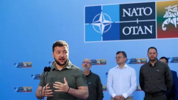 Ukraine's President Volodymyr Zelensky speaks with the media as he arrives at the NATO summit in Vilnius, Lithuania.