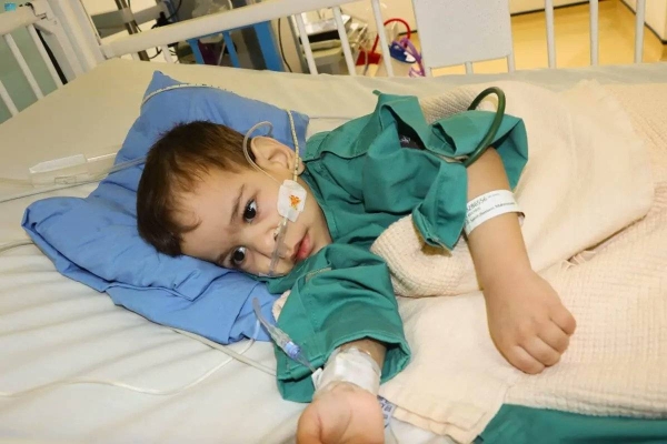 Dr. Abdullah Al Rabeeha examining Syrian twin Bassam.