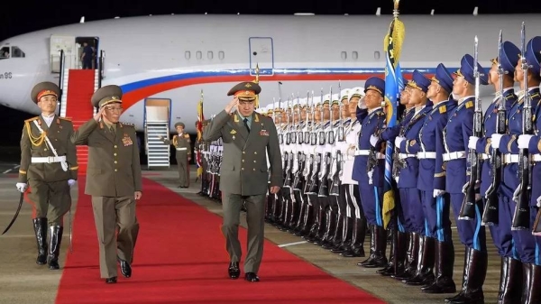 Russian Defense Minister Sergei Shoigu (center) welcomed at an airport in Pyongyang on 25 July