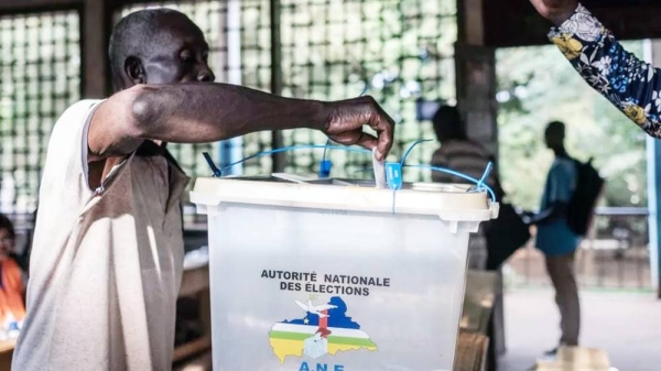 A voter casts his ballot at the Boganda high school in Bangui, on July 30. — courtesy Getty Images