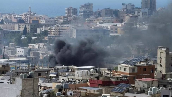 Smoke rises from Ain el-Hilweh Palestinian refugee camp during Palestinian faction clashes, in Lebanon.