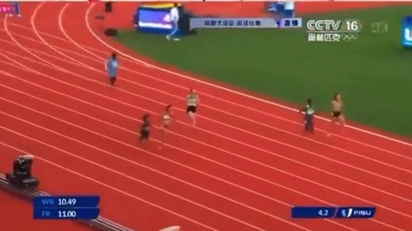 Nasro Abukar Ali, wearing blue in lane 4, competes in the women's 100-meter race at the International University Sports Federation's (FISU) Summer World University Games in China.