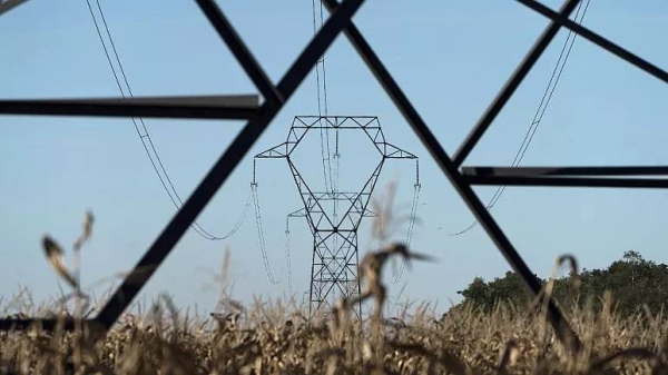 Electricity poles are seen in the countryside outside Lyon, central France